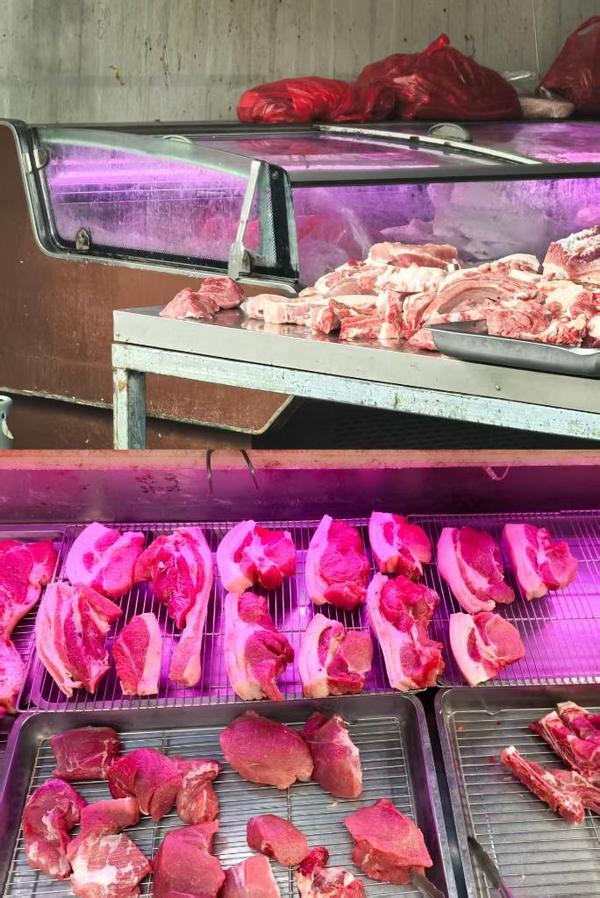 广西昭平县某临街肉铺仍在使用“生鲜灯”。(新华社记者王楚然 摄) 